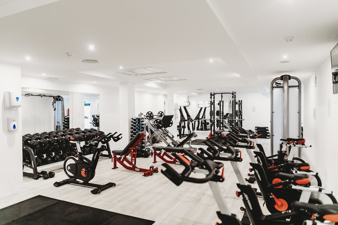 Empty gym floor with equipment ready for use