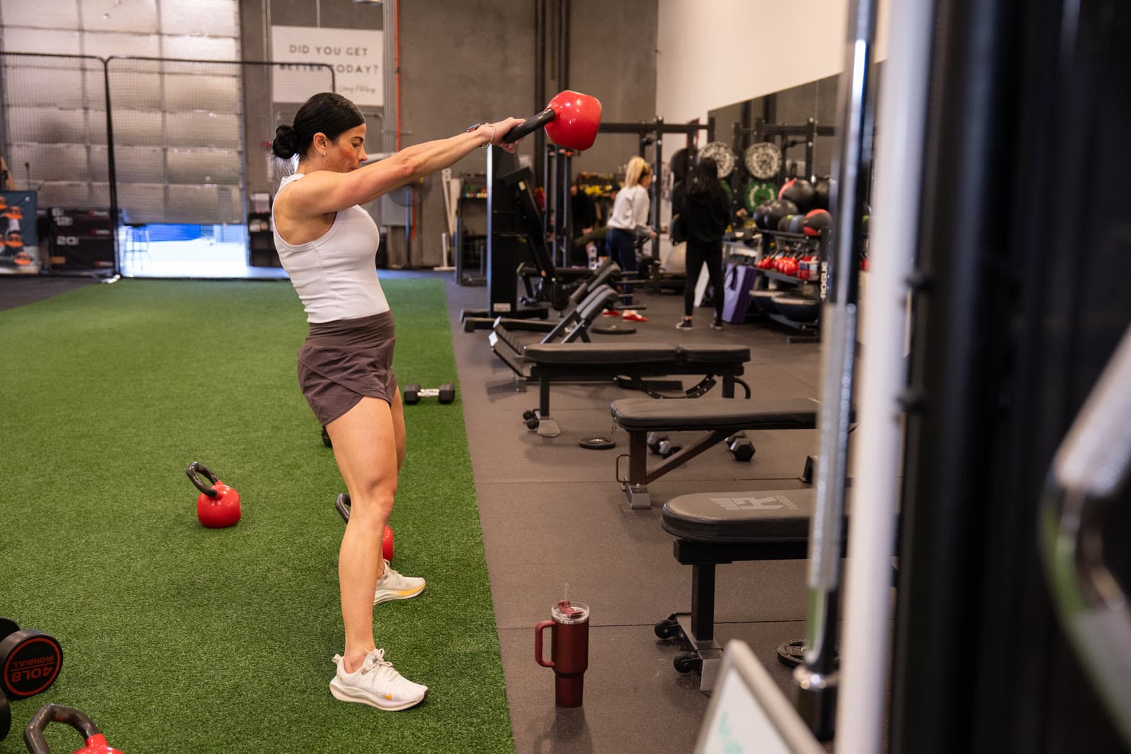 A member mid kettlebell swing at the My Way Fitness studio in Mesa